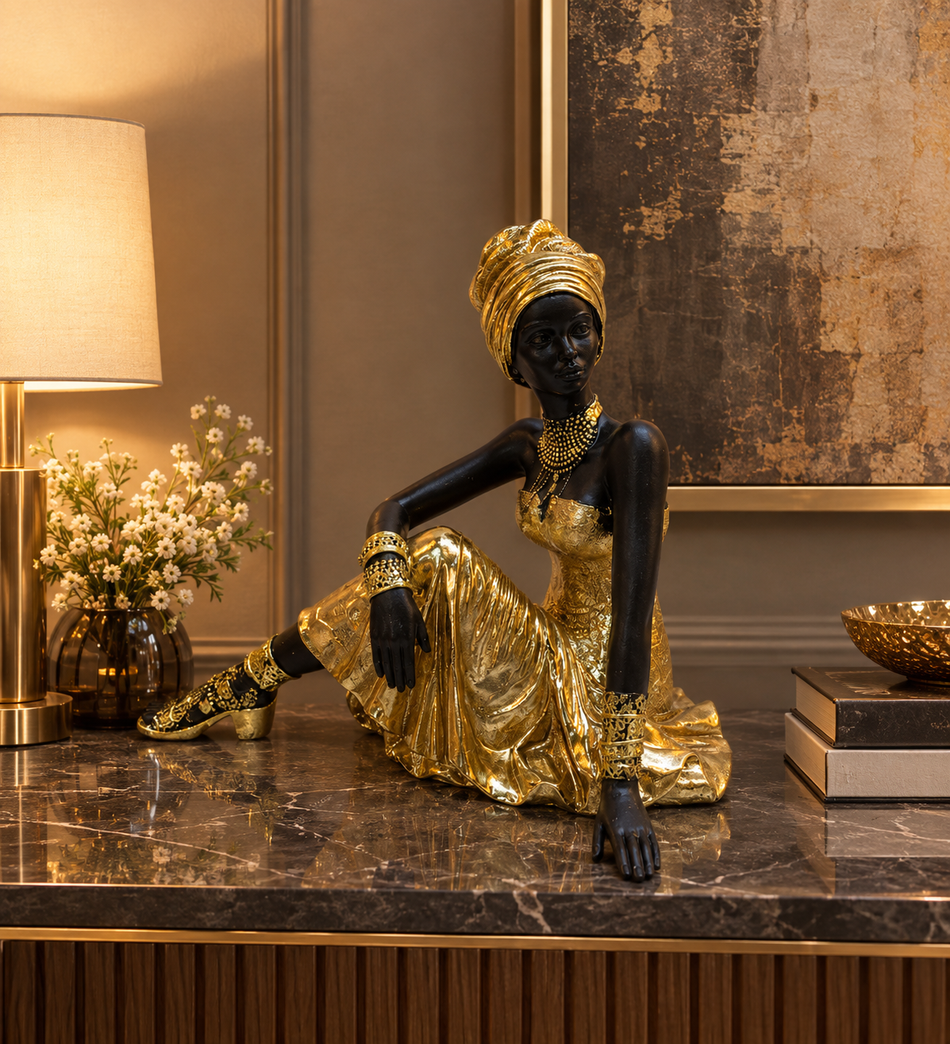 Seated African Lady Sculpture in Metallic Gold Dress and Headwrap