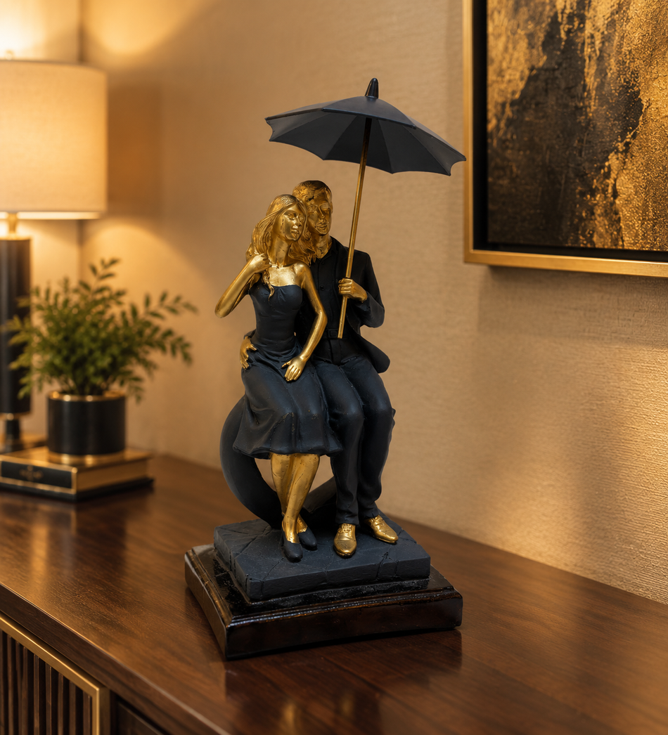 Romantic Couple Under Umbrella Figurine in Matte Black and Gold