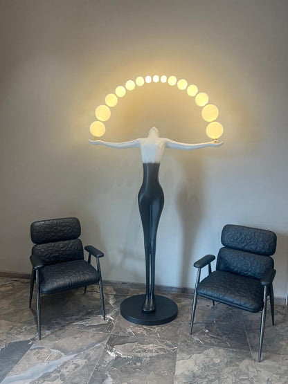 Designer Black White sculpture holding ball floor lamp