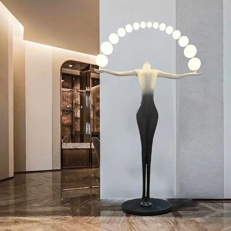 Designer Black White sculpture holding ball floor lamp